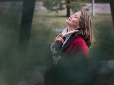 a-woman-enjoys-the-sun-in-nature-.jpg A woman enjoys the sun in nature.